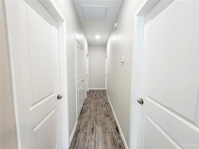 corridor featuring wood-type flooring