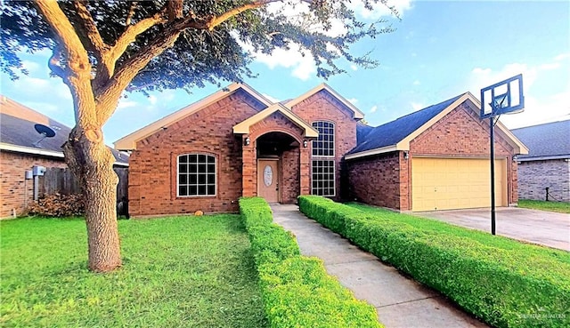 view of front of home with a front yard and a garage