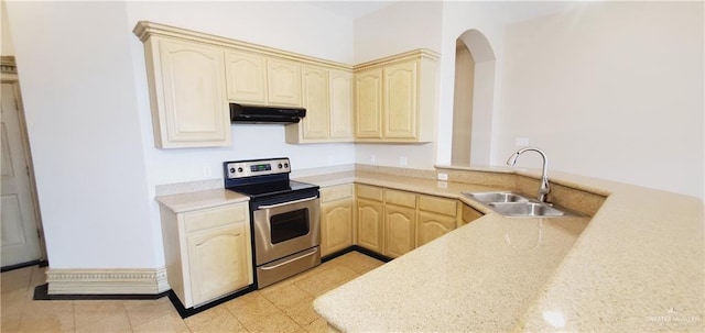 kitchen with kitchen peninsula, sink, light brown cabinetry, and stainless steel electric range