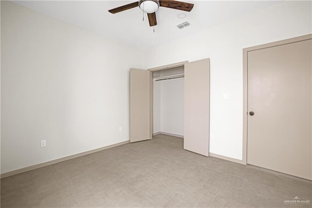 unfurnished bedroom with ceiling fan and a closet