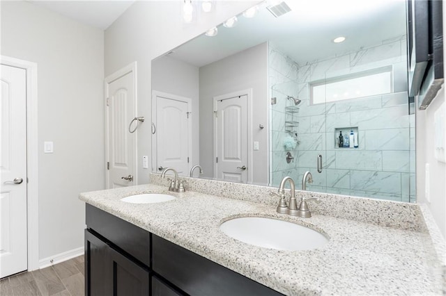 6101 White River Dr, Mcallen, TX 78504 - full bath featuring visible vents, a sink, a stall shower, and double vanity