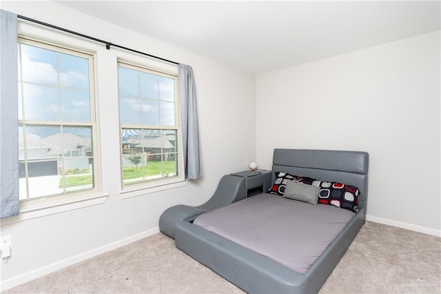6101 White River Dr, Mcallen, TX 78504 - bedroom featuring baseboards, multiple windows, and carpet flooring