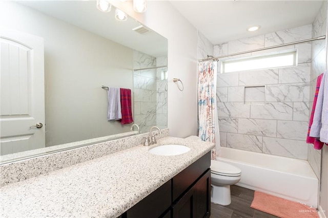 6101 White River Dr, Mcallen, TX 78504 - full bathroom featuring visible vents, wood finished floors, vanity, toilet, and shower / tub combo with curtain