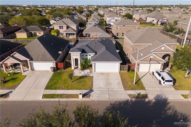 birds eye view of property with a residential view