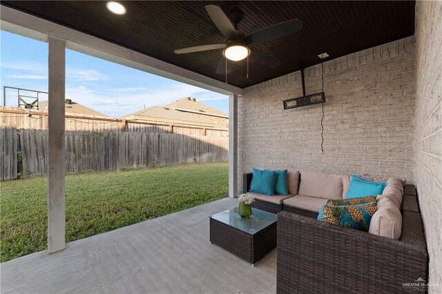 view of patio featuring a ceiling fan, a fenced backyard, and an outdoor living space