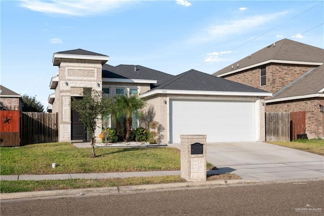 view of front facade with a garage, driveway, a front yard, and fence