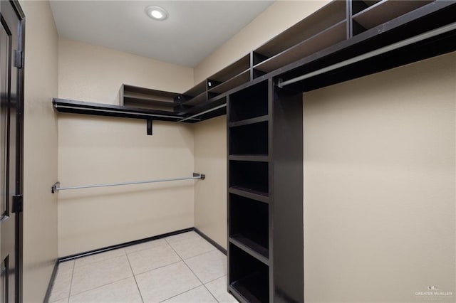 walk in closet featuring light tile patterned floors