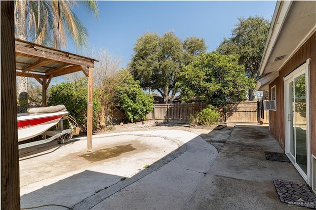 view of patio / terrace featuring cooling unit and a fenced backyard