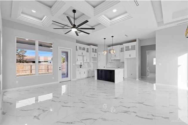 unfurnished living room featuring a sink, a ceiling fan, recessed lighting, and baseboards