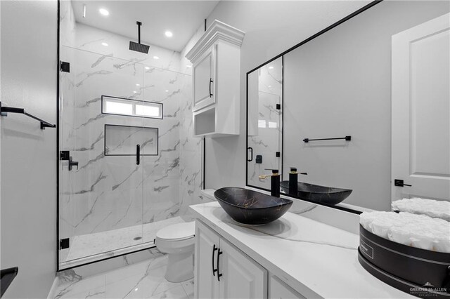 full bath with recessed lighting, vanity, toilet, a marble finish shower, and marble finish floor