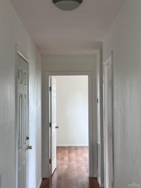 1056 E Mile 11 N, Weslaco, TX 78599 - corridor featuring wood finished floors and baseboards