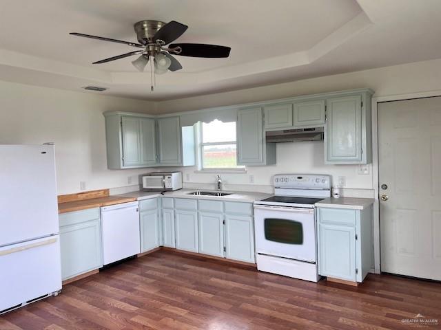 1056 E Mile 11 N, Weslaco, TX 78599 - kitchen with white appliances, under cabinet range hood, light countertops, dark wood-style flooring, and a ceiling fan