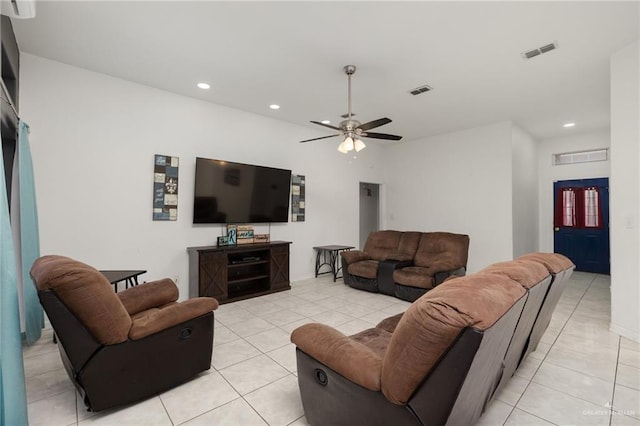 tiled living room with ceiling fan