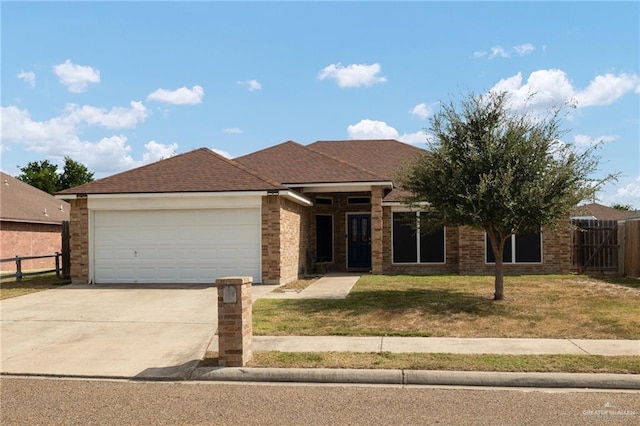 single story home featuring a garage and a front lawn