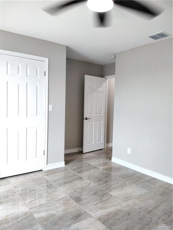 3018 Greenwood Dr, Corpus Christi, TX 78405 - unfurnished bedroom with baseboards, visible vents, and ceiling fan