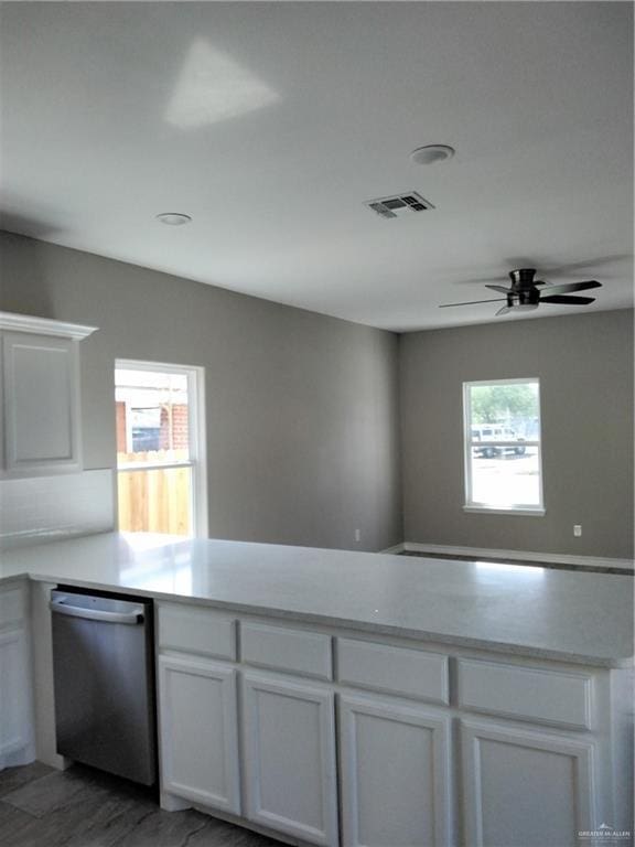 3018 Greenwood Dr, Corpus Christi, TX 78405 - kitchen featuring dishwasher, a peninsula, a healthy amount of sunlight, and visible vents