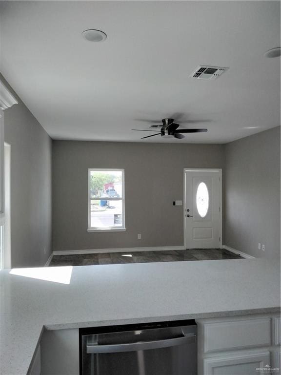 3018 Greenwood Dr, Corpus Christi, TX 78405 - kitchen with light countertops, visible vents, dishwasher, ceiling fan, and white cabinetry
