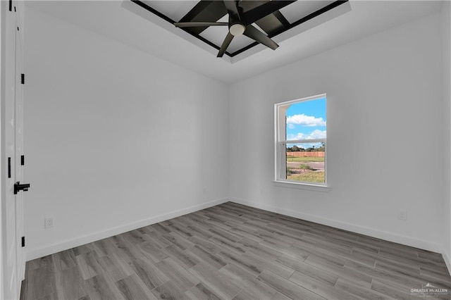 unfurnished room with light wood-type flooring and ceiling fan