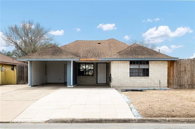 ranch-style home featuring a carport