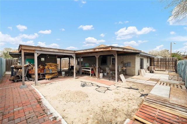 back of house with a patio