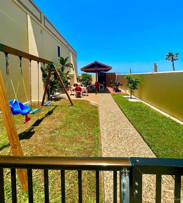 2100 Gulf Blvd, South Padre Island, TX 78597 - fenced backyard featuring a patio