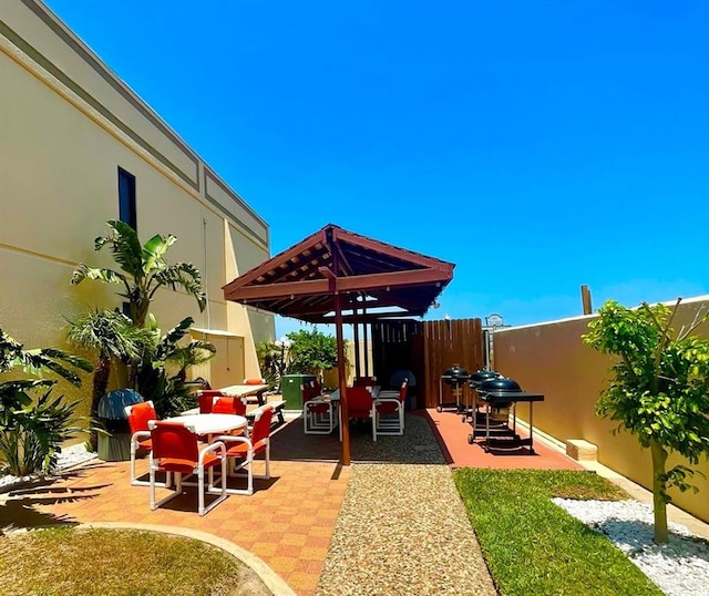 2100 Gulf Blvd, South Padre Island, TX 78597 - view of patio / terrace with outdoor dining space and grilling area