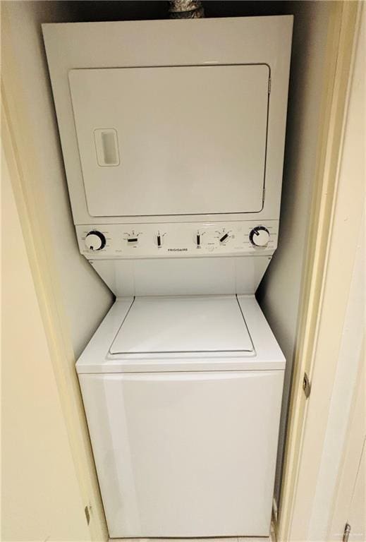 2100 Gulf Blvd, South Padre Island, TX 78597 - laundry room featuring stacked washer and clothes dryer