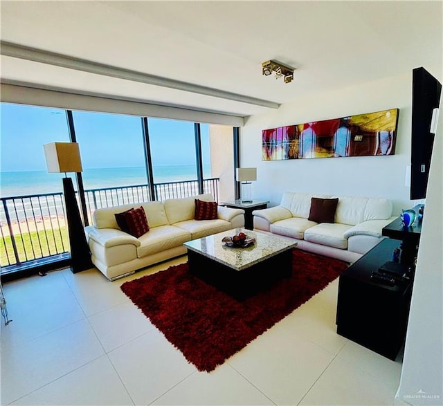 2100 Gulf Blvd, South Padre Island, TX 78597 - living room with a water view and tile patterned flooring