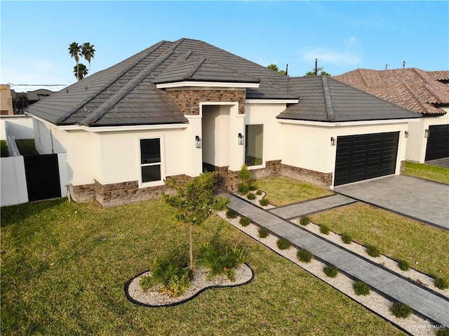 view of front facade with a front yard and a garage