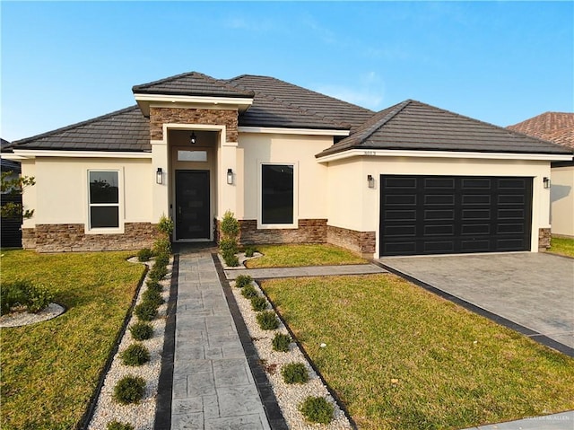 prairie-style house with a front lawn and a garage