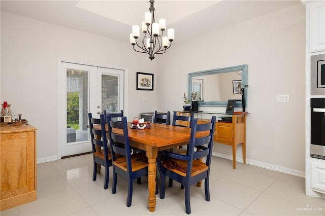 2509 Mcleod Ave, Edinburg, TX 78539 - dining room featuring french doors, a chandelier, baseboards, and light tile patterned flooring