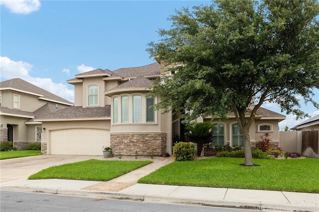 2509 Mcleod Ave, Edinburg, TX 78539 - view of front facade with stucco siding, stone siding, and concrete driveway