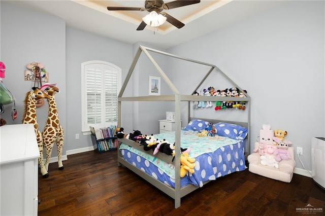 2509 Mcleod Ave, Edinburg, TX 78539 - bedroom featuring wood-type flooring, baseboards, and a ceiling fan