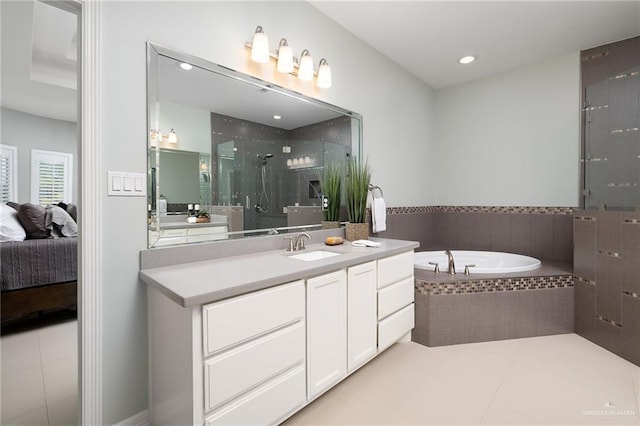 2509 Mcleod Ave, Edinburg, TX 78539 - ensuite bathroom featuring vanity, a stall shower, a bath, tile patterned floors, and recessed lighting
