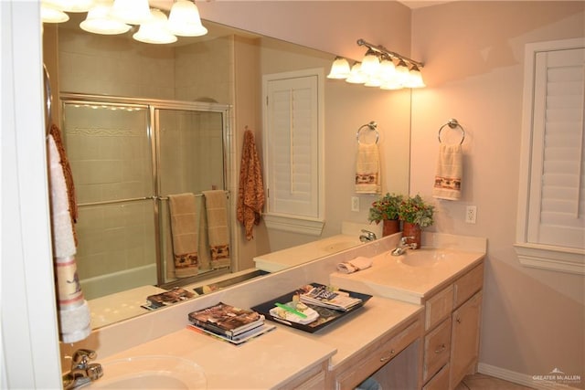2707 Live Oak St, Mission, TX 78574 - full bathroom featuring a shower with shower door and double vanity
