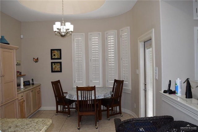 2707 Live Oak St, Mission, TX 78574 - dining area featuring a chandelier, light tile patterned floors, and baseboards