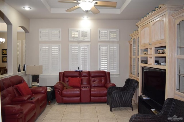 2707 Live Oak St, Mission, TX 78574 - living area featuring a raised ceiling, arched walkways, ceiling fan, and light tile patterned floors