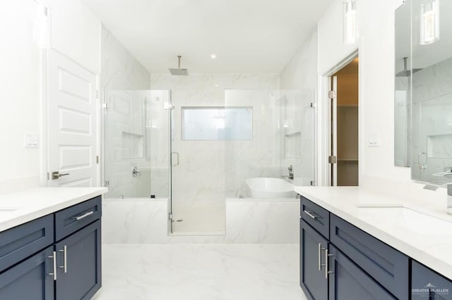 bathroom featuring vanity and separate shower and tub