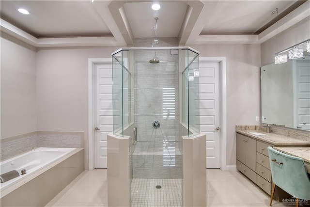 bathroom with plus walk in shower, vanity, a tray ceiling, and tile patterned floors