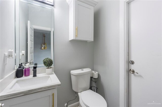 bathroom with vanity and toilet