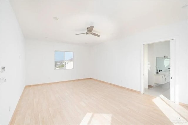 unfurnished room featuring ceiling fan and light hardwood / wood-style floors