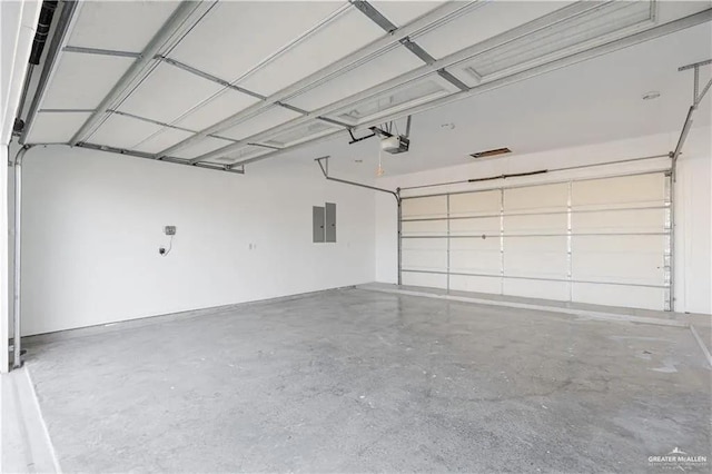 garage featuring electric panel and a garage door opener