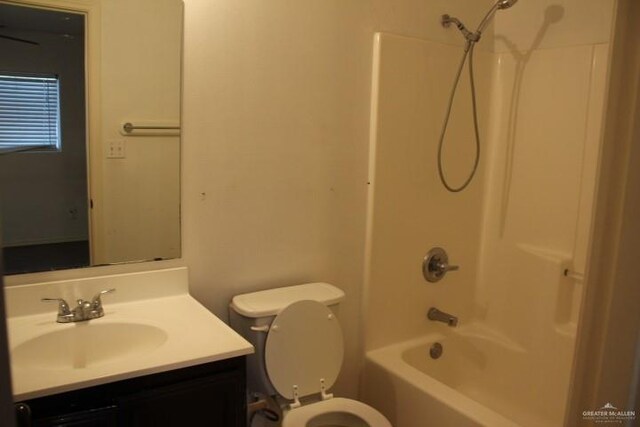 full bathroom featuring shower / bathing tub combination, vanity, and toilet