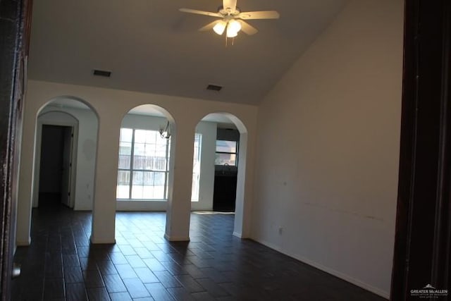 spare room with ceiling fan and vaulted ceiling