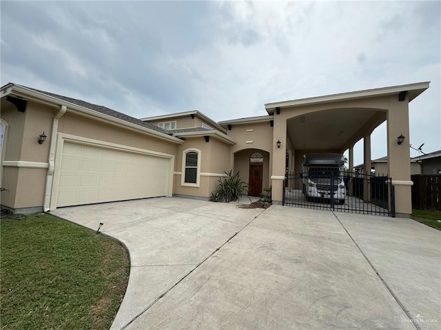 view of front of property featuring a garage and a carport