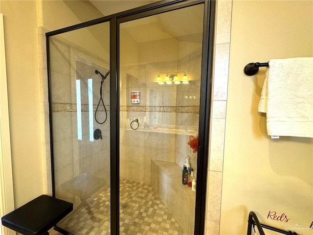 bathroom with a shower with shower door