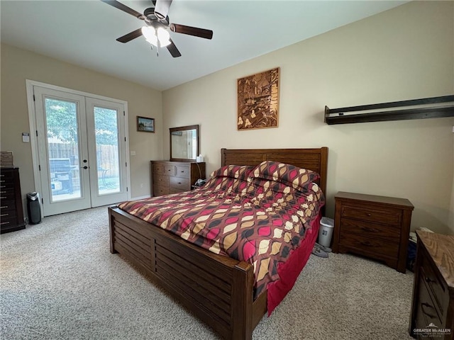 carpeted bedroom with access to exterior, french doors, and ceiling fan