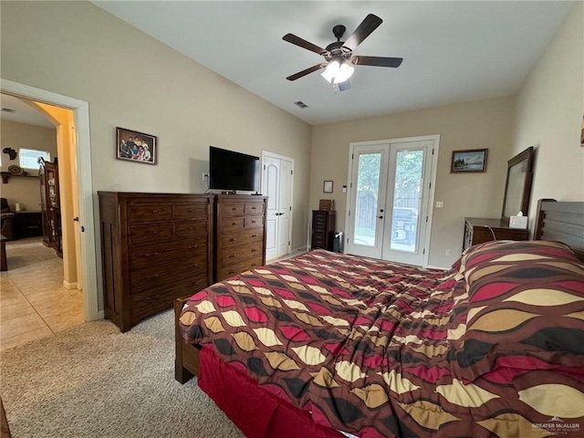 bedroom featuring access to exterior, ceiling fan, french doors, and light carpet