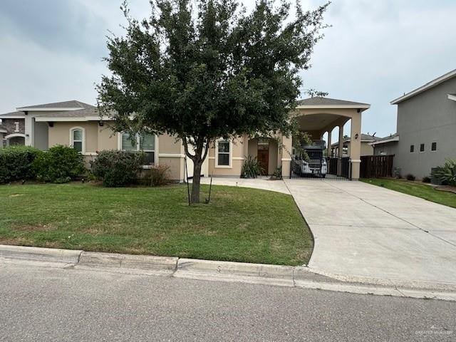 view of front of property featuring a carport and a front lawn