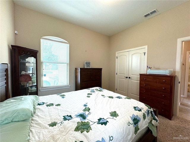 bedroom with carpet flooring and a closet